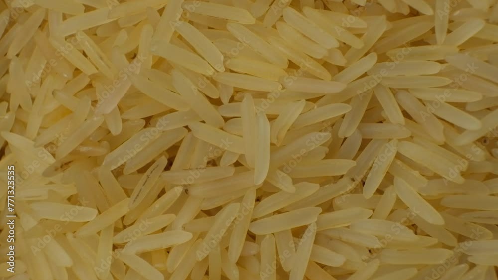 Long grain parboiled basmati rice macro slow motion Long grain parboiled basmati rice macro slow motion
