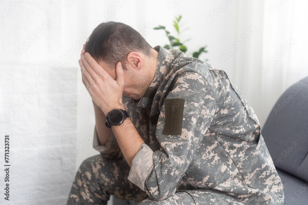 Obraz premium Nervous male military suffering depression, sitting alone at home, PTSD concept