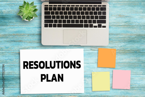 Business quotes, RESOLUTIONS PLAN on notebook or paper in office desk, office workplace photo