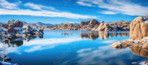 A serene lake surrounded by...