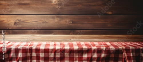 A rustic wooden table is co...