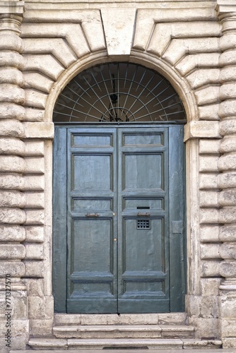 doors of Rome. Classic old wooden door in a public place on a city street or in an urban environment