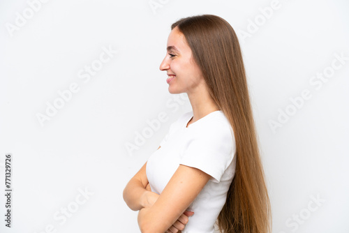 Young caucasian woman isolated on white background in lateral position