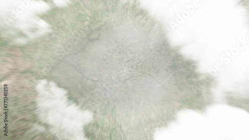 Earth zoom in from space to Mbarara, Uganda. Followed by zoom out through clouds and atmosphere into space. Satellite view. Travel intro. Images from NASA photo