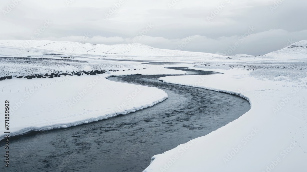 River Flowing Through Snow Covered Landscape
