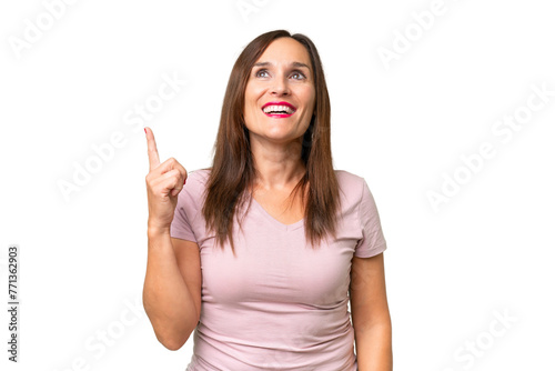 Middle-aged caucasian woman over isolated background pointing up and surprised © luismolinero