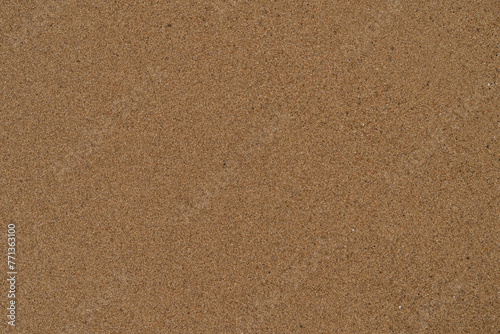 Texture of wet sand on a beach top view