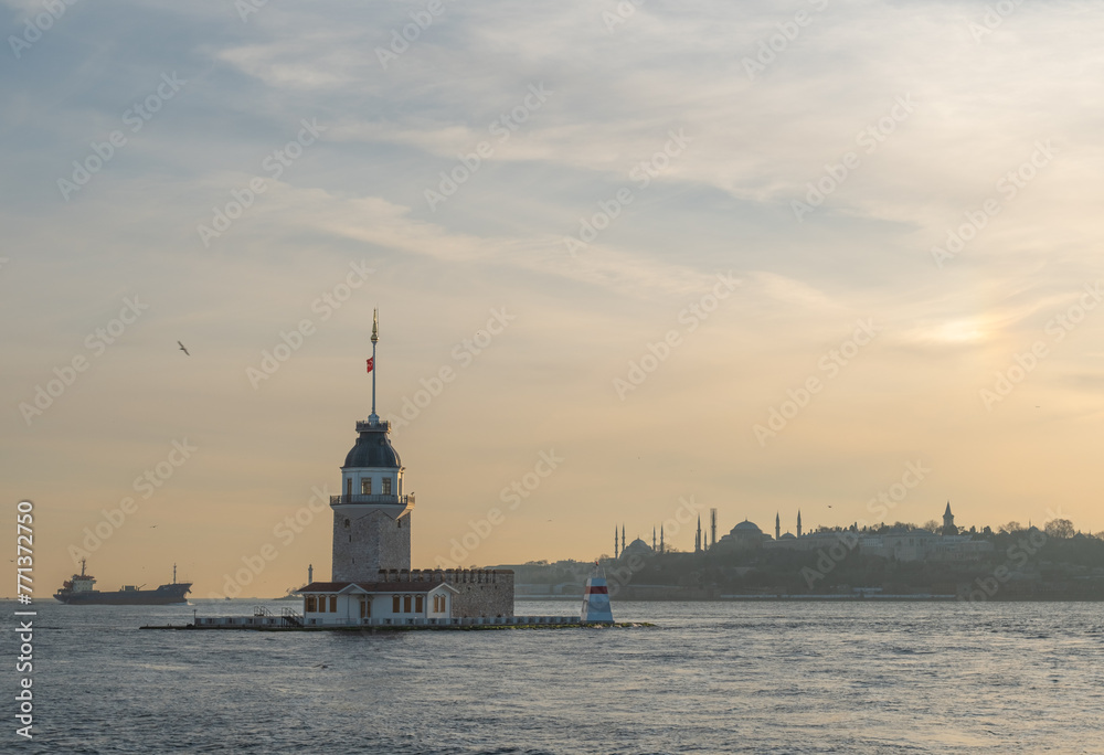 Beautiful sunset over Bosphorus with famous Maiden's Tower (Kiz Kulesi) also known as Leander's Tower, symbol of Istanbul, Turkey. Scenic travel background.
