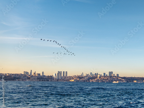 Beautiful sunset over Bosphorus with famous Maiden's Tower (Kiz Kulesi) also known as Leander's Tower, symbol of Istanbul, Turkey. Scenic travel background. photo