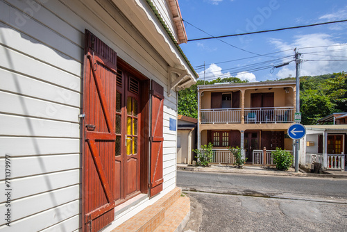 Deshaies, historic Caribbean wooden buildings on a street in Guadeloupe, Caribbean, French Antilles photo