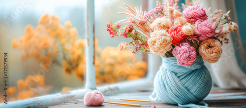 Colorful knitting yarn thread creative bouquet banner. Knitting shop special offer, handmade, Yarn for knitting sale. Needlework. Flowers made of colorful balls of wool and cotton yarn for knitting