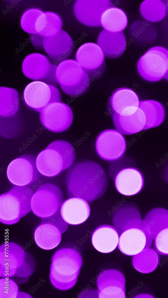 Purple bokeh lights background. Shiny Violet blurred lights. Vertical video. Purple bokeh lights background. Shiny Violet blurred lights. Vertical video.