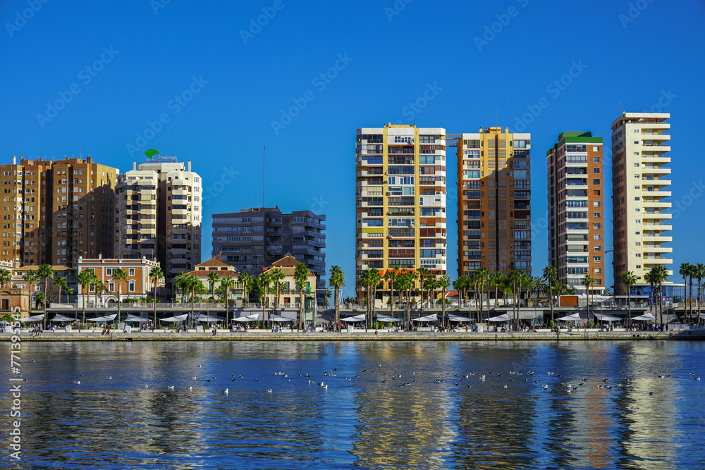 View of the high-rise buildings along the harbor of Malaga Spain