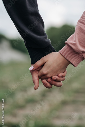 couple hold each other hands