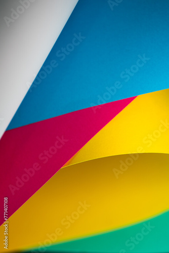 Abstract background with wavy sheets of paper. Desktop walldrop. Macro photography colorful composition.