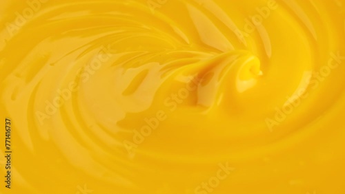 Cheese sauce. Chef stirring cheese sauce with whisk photo