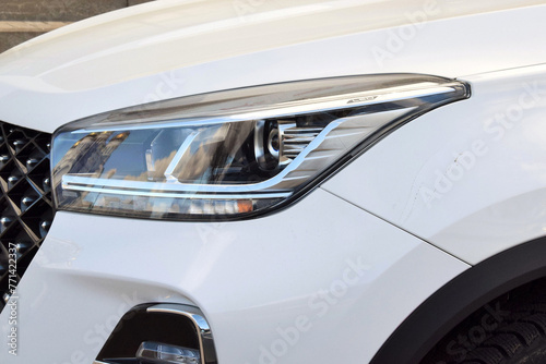 Headlight of a beautiful white car