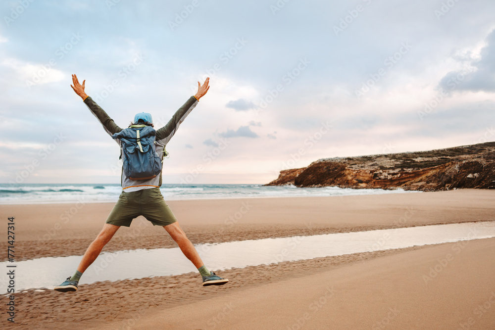 Man with backpack jumping on the beach tourist traveling in Greece healthy lifestyle happy emotions success concept adventure active summer vacations outdoor Man with backpack jumping on the beach tourist traveling in Greece healthy lifestyle happy emotions success concept adventure active summer vacations outdoor