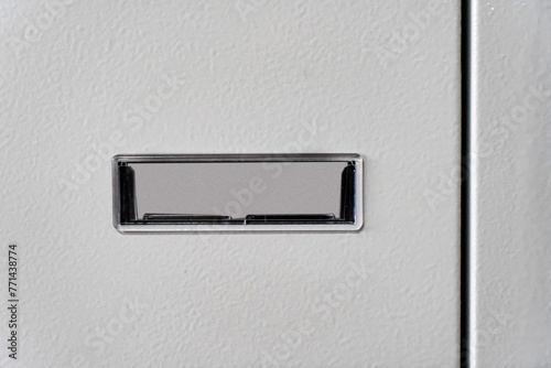 Fragment of the door of metal lockers for locker room. Change room metal locker box on the white background isolated.