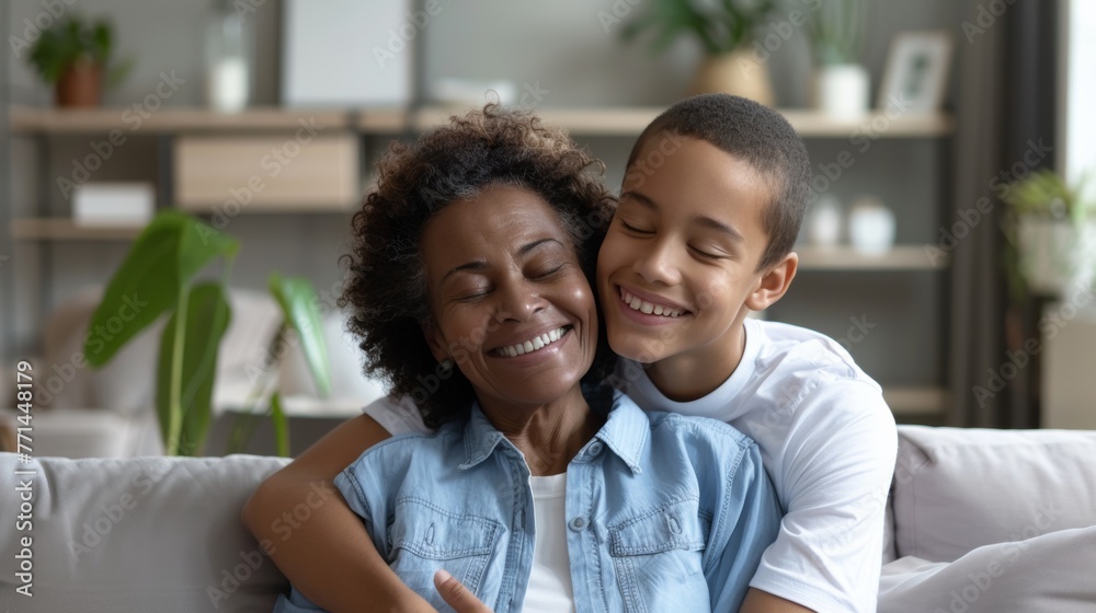 Joyful African American grandmother and grandson hugging, love and family concept Joyful African American grandmother and grandson hugging, love and family concept