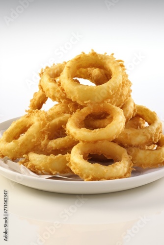 Onion rings served on plate Highly detailed close up image.. © Twomeows_AS