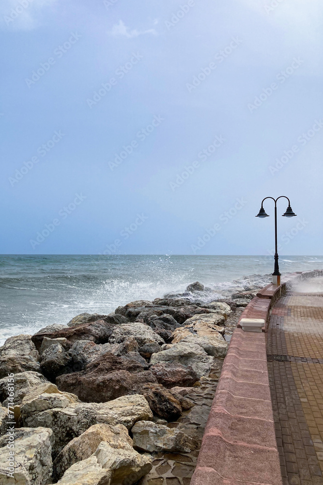Obraz premium Sea storm on wharf in Torremolinos, Spain