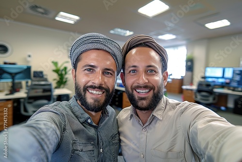 arabian two men in the office taking selfie 