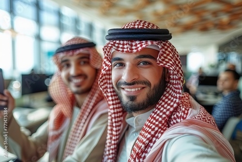 arabian two men in the office taking selfie  © urwa