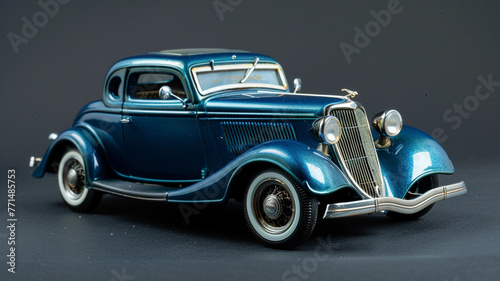 Die-cast model of a vintage blue coupe. photo