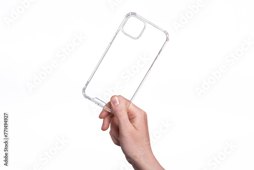 Clear iPhone 15 Plus case isolated on white background. Silicone case in a female hand. Phone case mock up. Holding phone cover in hand
