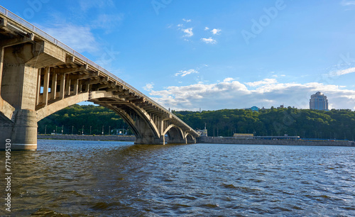 Fototapeta Naklejka Na Ścianę i Meble -  Large subway metro bridge across the Dnieper river on a hot sunny day