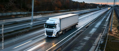 White truck on highway with natural landscape. Aerial photography with copy space. Logistics