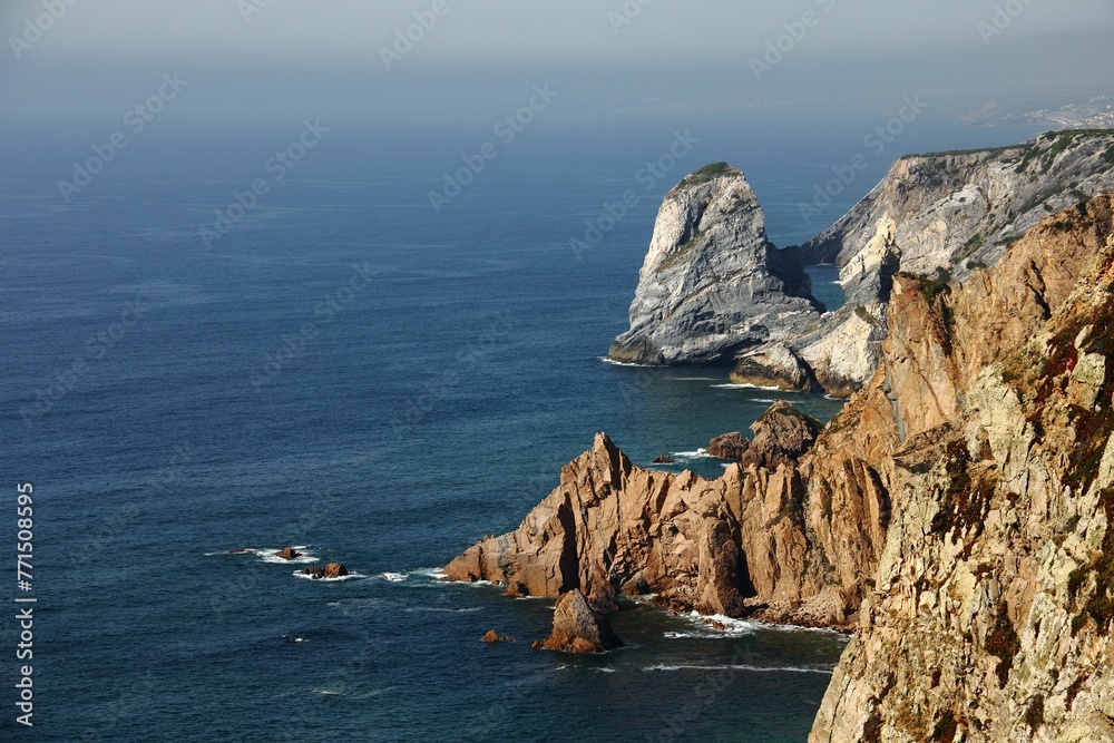Aerial view of majestic cliffs and tranquil blue sea. Cabo da Roca, Portugal.