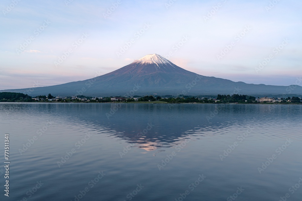 Scenic view of Mount Fuji against a stunning pastel blue and pink sunrise sky backdrop