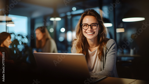 Happy Woman Watching Online Course in Office, Blurred Background Showing Working Colleagues