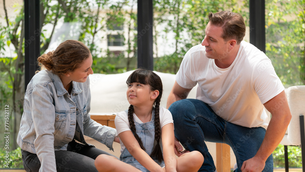 Parents comforting their daughter with loving embrace, helping her feel secure and protected as she rest her head on their shoulder. Happy family love and child care support Panorama. Synchronos