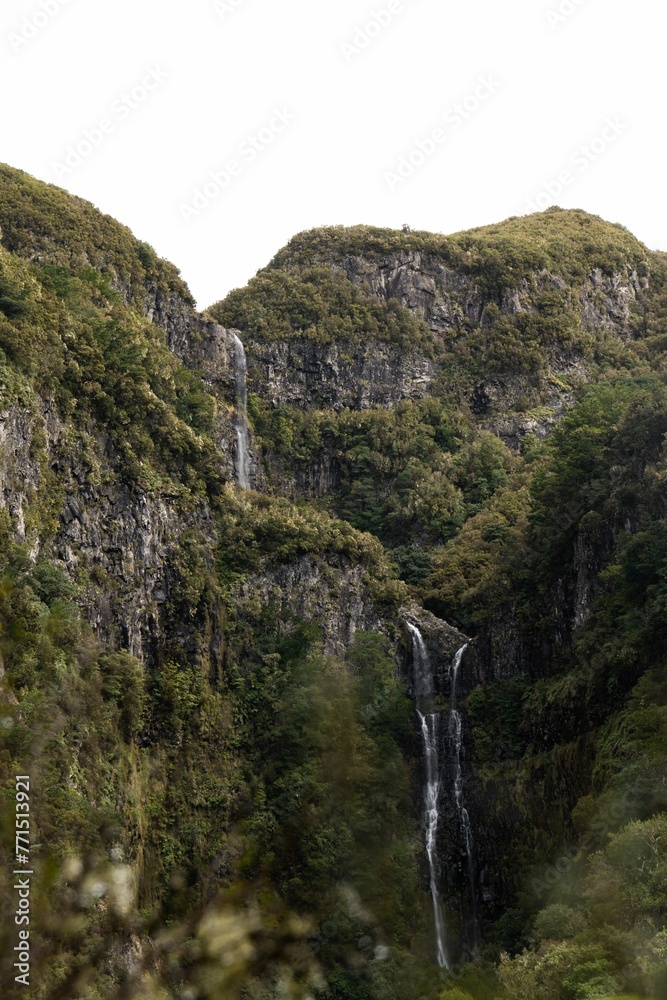Mountain range with cascading waterfall Mountain range with cascading waterfall