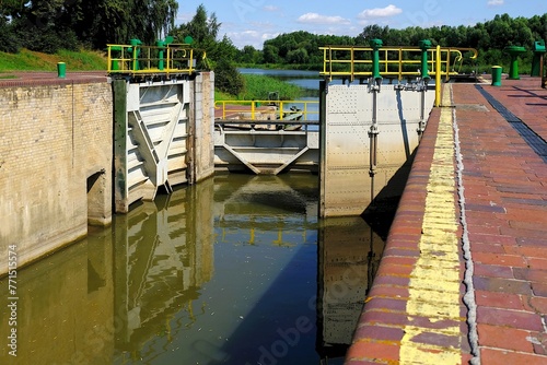 Lock gates of the water dam in river. Dam on river Nogat in Biala Gora (Biała Góra). © Iwona