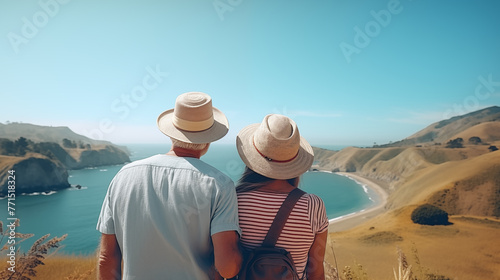 Elderly couple admiring the view from a bird's eye view of the coastal sea