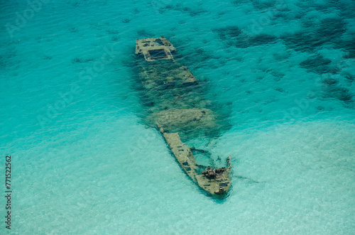 Sunken ship at the reef in Kuna Yala. San Blas archipelago, Caribbean, Panama, Central America. photo