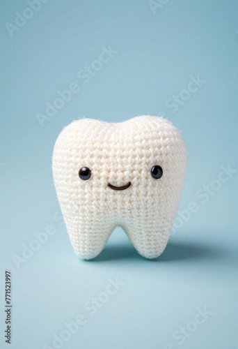 Knitted cute tooth toy, amigurumi style, pediatric dentistry