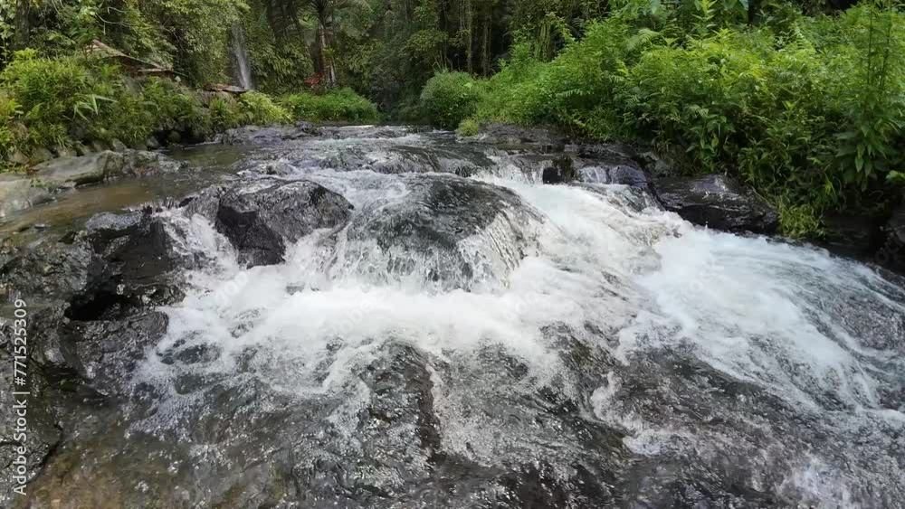 Mountain water flowing clear through the rocks Mountain water flowing clear through the rocks
