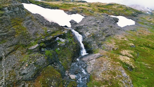 Drone footage over Nyastolfossen Waterfall landscape in Norway with rocky canyon photo