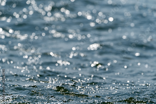 Foto Blue water with ripples on the surface defocus blurred blue colored clear calm w
