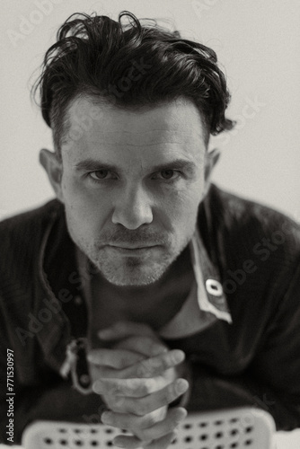 man in a leather jacket looks