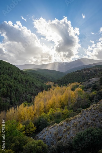 sun rays over the mountains in california's big sur region