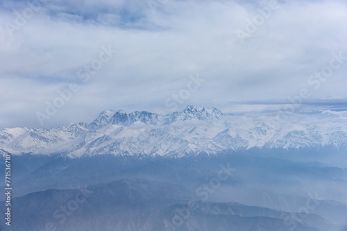 Aerial view of the snow-capped Ten-Zan Bodga peak © Wirestock