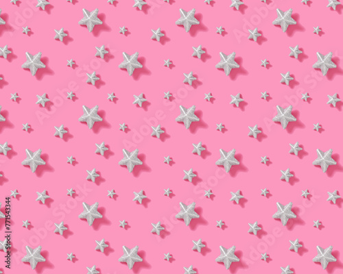Pattern of light silver stars on pink background