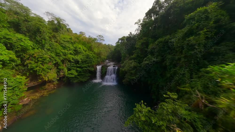 Aerial view of tropical waterfall among the lush jungle in Thailand. Aerial view of tropical waterfall among the lush jungle in Thailand.