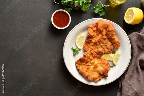 Schnitzel with lemon and leaves of parsley
